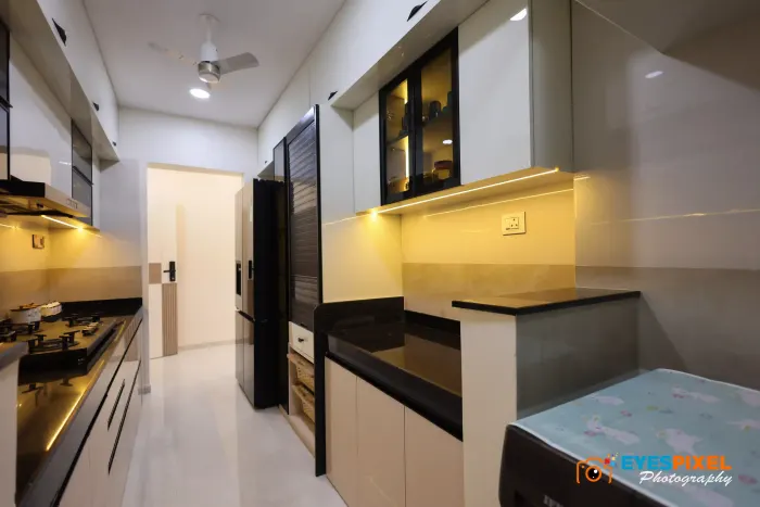 Kitchen looking through to the utility area and washing machine