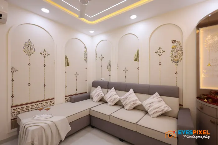 Wide view of a living room with arched panelling and cove lighting