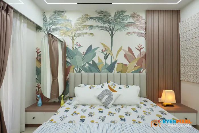 Leaf mural feature wall behind a bed, with fitted bedside drawers