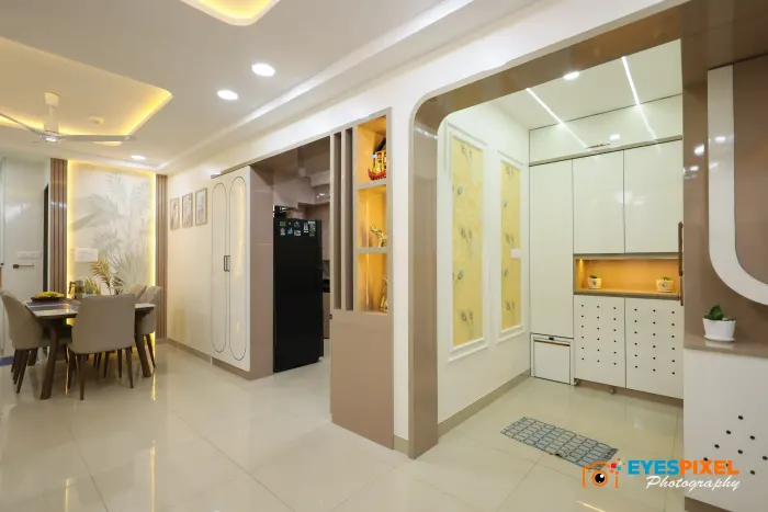 Dining area seen past the foyer storage and a curved partition