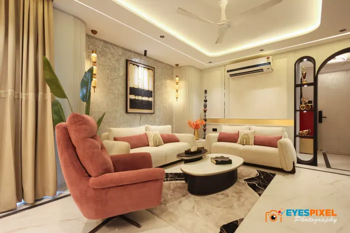 Living room sofa and armchair arranged around a marble-topped coffee table