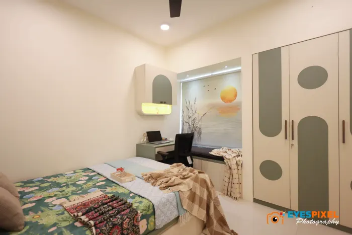 Bedroom wardrobe with a curved lit niche beside the bed