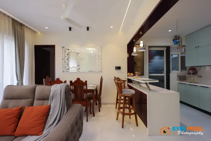 Living room looking through to a breakfast counter and open kitchen