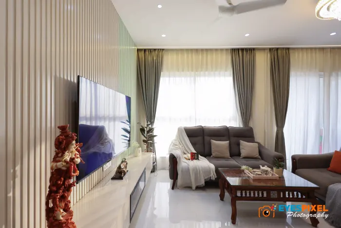 Living room television wall with daylight from full-height windows